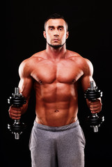 Fototapeta na wymiar Handsome muscular sportsman isolated