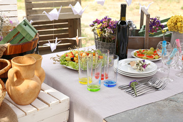 Buffet table with dishware waiting for guests