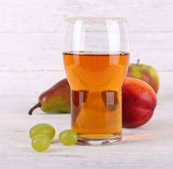 tasty summer drink with fresh fruits, on wooden table