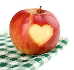 Red apple with heart isolated on white
