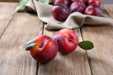 Sweet plums on wooden background