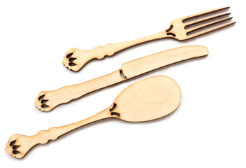 Decorative wooden utensils isolated on white