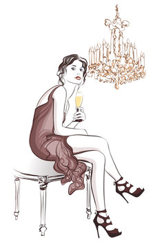 Woman drinking champagne in a stylish decor