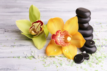 Tropical orchid flowers and spa stones