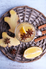 Cup of ginger drink with lemon