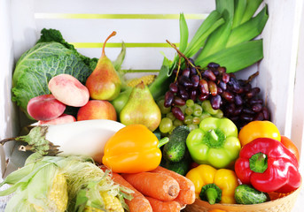 Vegetables on wooden box background closeup