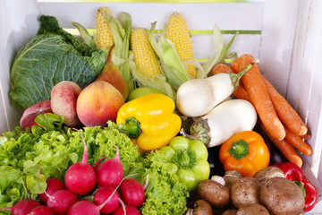 Vegetables on wooden box background closeup