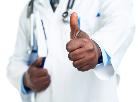 Doctor with finger up on white