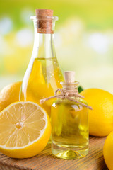 Lemon oil on table on light background
