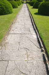 Stone alley in English formal garden