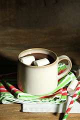 Hot chocolate with marshmallows, on wooden background