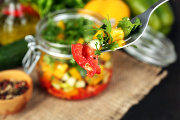 Vegetable salad in glass jar,
