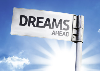 Dreams Ahead written on the road sign