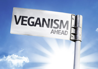 Veganism Ahead written on the road sign