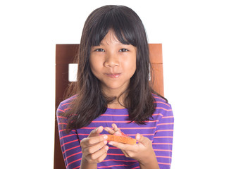 Young Malay Asian preteen girl having breakfast 