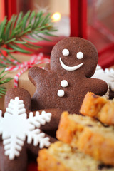 Chocolate cookie gingerbread man with Christmas sweets