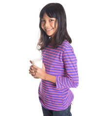 Young Asian preteen girl with a glass of milk