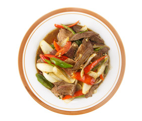 Stir fried meat with chilli pepper isolated on white