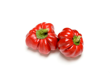 Two bell peppers from the kitchen garden, isolated on white background