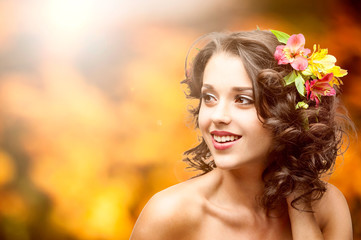 beautiful young woman over autumn background