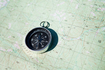 Fototapeta na wymiar Compass over map