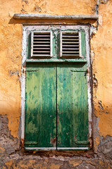 Old window with green shutters
