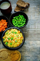 Indian vegetarian pilaf, Biriyani, with carrots and green peas