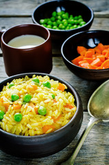 Indian vegetarian pilaf, Biriyani, with carrots and green peas