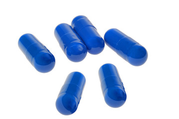 Heap of pills isolated on white background