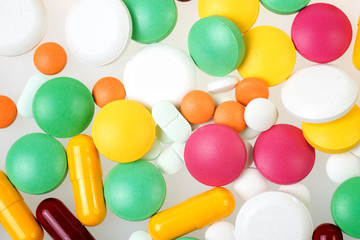 Heap of pills isolated on white background