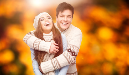 happy young couple over autumn background