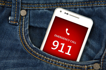 mobile phone in pocket with emergency number 911. focus on scree