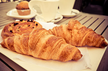 coffee and croissants on table