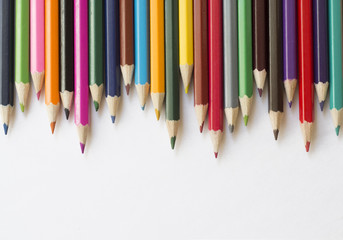 Colored pencils on white background
