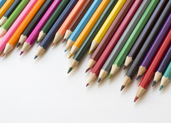 Colored pencils on white background