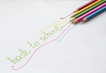 Colored pencils on white background