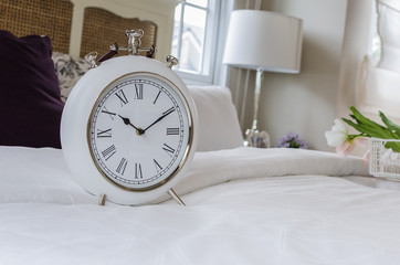 classic white alarm clock style in classic bedroom