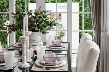 glass dinning table with chair and flower