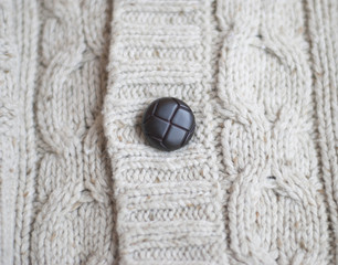 button on a knitted sweater