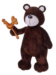 Brown teddy bear with wooden rattle