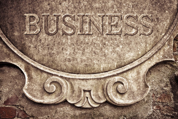 Business written on stucco wall - concept image