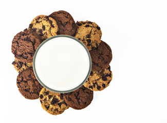 Milk glass  and cookies on white background