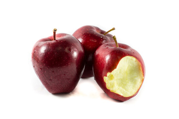 bitten red apple on a white background