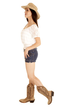 Brunette cowgirl stand facing side full body