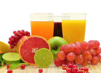 Fresh fruit and three glasses full of juice