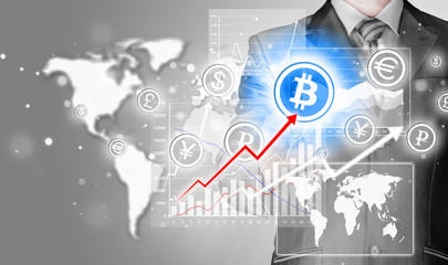 Choosing bitcoins, businessman pressing touch screen button.