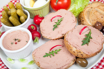 slices of bread with home made pate, decorated with vegetables