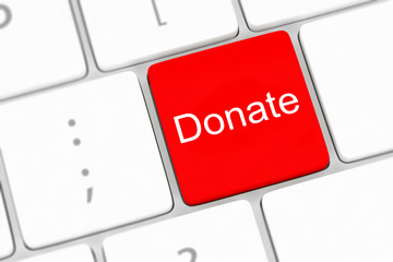 Fototapeta premium donate key word on computer keyboard,