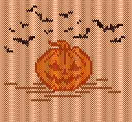 Halloween pumpkin on a knit background