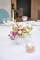 Table set for an event party or wedding reception with candle an